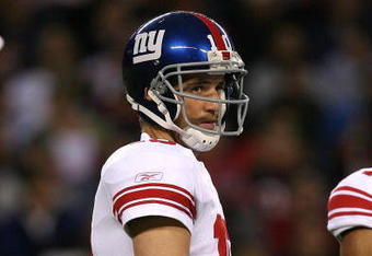 CHICAGO - AUGUST 22: Eli Manning #10 of the New York Giants looks to the sidelines for a play during a pre-season game against the Chicago Bears on August 22, 2009 at Soldier Field in Chicago, Illinois. The Bears defeated the Giants 17-3. (Photo by Jonathan Daniel/Getty Images)