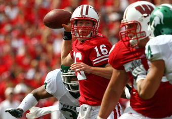 MADISON, WI - SEPTEMBER 26:  Scott Tolzien #16 of the Wisconsin Badgers passes under pressure from the Michigan State Spartans on September 26, 2009 at Camp Randall Stadium in Madison, Wisconsin.  (Photo by Jonathan Daniel/Getty Images)