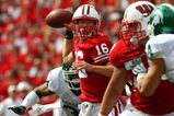 MADISON, WI - SEPTEMBER 26:  Scott Tolzien #16 of the Wisconsin Badgers passes under pressure from the Michigan State Spartans on September 26, 2009 at Camp Randall Stadium in Madison, Wisconsin.  (Photo by Jonathan Daniel/Getty Images)