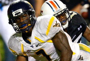 AUBURN, AL - SEPTEMBER 19:  Noel Devine #7 of the West Virginia Mountaineers scores a touchdown against Neiko Thorpe #15 of the Auburn Tigers at Jordan-Hare Stadium on September 19, 2009 in Auburn, Alabama.  (Photo by Kevin C. Cox/Getty Images)