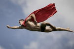 SISIKON, SWITZERLAND - SEPTEMBER 05: (EDITORIAL USE ONLY) In this handout image provided by Dean Treml/Red Bull Photofiles, Michal Navratil of the Czech Republic performs a 'Superman' dive from the 26 metre platform during round seven of the Red Bull Cliff Diving series on September 5, 2009 in Sisikon, Switzerland. (Photo by Dean Treml/Red Bull Photofiles via Getty Images)