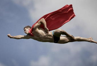 SISIKON, SWITZERLAND - SEPTEMBER 05: (EDITORIAL USE ONLY) In this handout image provided by Dean Treml/Red Bull Photofiles, Michal Navratil of the Czech Republic performs a 'Superman' dive from the 26 metre platform during round seven of the Red Bull Cliff Diving series on September 5, 2009 in Sisikon, Switzerland. (Photo by Dean Treml/Red Bull Photofiles via Getty Images)