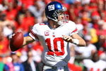 KANSAS CITY, MO - OCTOBER 04:  Quarterback Eli Manning #10 of the New York Giants passes during the game against the Kansas City Chiefs on October 4, 2009 at Arrowhead Stadium in Kansas City, Missouri.  (Photo by Jamie Squire/Getty Images)