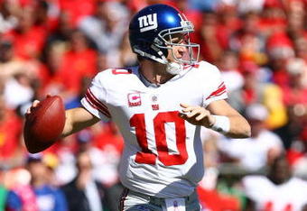 KANSAS CITY, MO - OCTOBER 04:  Quarterback Eli Manning #10 of the New York Giants passes during the game against the Kansas City Chiefs on October 4, 2009 at Arrowhead Stadium in Kansas City, Missouri.  (Photo by Jamie Squire/Getty Images)
