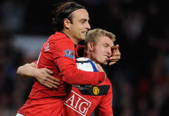 MANCHESTER, ENGLAND - OCTOBER 03:  Dimitar Berbatov of Manchester United celebrates scoring his team's first goal with Darren Fletcher (R) during the Barclays Premier League match between Manchester United and Sunderland at Old Trafford on October 3, 2009 in Manchester, England.  (Photo by Michael Regan/Getty Images)