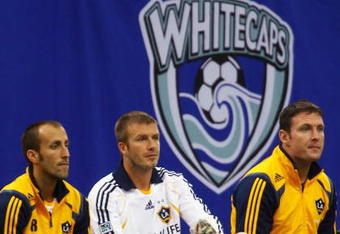 VANCOUVER, CANADA - NOVEMBER 7:  David Beckham #23 of the Los Angeles Galaxy puts on his shoe at the end of their exhibition soccer match against the Vancouver Whitecaps at BC Place Stadium on November 7, 2007 in Vancouver, British Columbia, Canada.  The game finished in a scoreless tie.  (Photo By Jeff Vinnick/Getty Images)