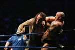 SYDNEY, AUSTRALIA - JUNE 15:  The Undertaker (L) pushes Bam Neely into the corner during WWE Smackdown at Acer Arena on June 15, 2008 in Sydney, Australia.  (Photo by Gaye Gerard/Getty Images)