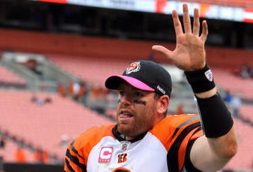 CLEVELAND - OCTOBER 04:  Carson Palmer #9 of the Cincinnati Bengals waves to his teams fans after defeating the Cleveland Browns at Cleveland Browns Stadium on October 4, 2009 in Cleveland, Ohio. The Bengals defeated the Browns 23-20 in overtime.  (Photo by Jim McIsaac/Getty Images)