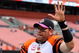 CLEVELAND - OCTOBER 04:  Carson Palmer #9 of the Cincinnati Bengals waves to his teams fans after defeating the Cleveland Browns at Cleveland Browns Stadium on October 4, 2009 in Cleveland, Ohio. The Bengals defeated the Browns 23-20 in overtime.  (Photo by Jim McIsaac/Getty Images)