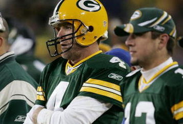 GREEN BAY, WI - NOVEMBER 6:  Quarterbacks Brett Favre #4 and Aaron Rodgers #12 of the Green Bay Packers watch the final minutes of a game against the Pittsburgh Steelers from the sideline November 6, 2005 at Lambeau Field in Green Bay, Wisconsin. The Steelers defeated the Packers, 20-10.  (Photo by Jonathan Daniel/Getty Images)