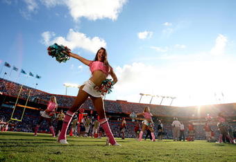 MIAMI - OCTOBER 04:  A Dolphins cheerleader performs as the Buffalo Bills take on the Miami Dolphins at Land Shark Stadium on October 4, 2009 in Miami, Florida. The Dolphins defeated the Bills 38-10. Many players and officials in the NFL wore pink as part of breast cancer awareness month.  (Photo by Doug Benc/Getty Images)