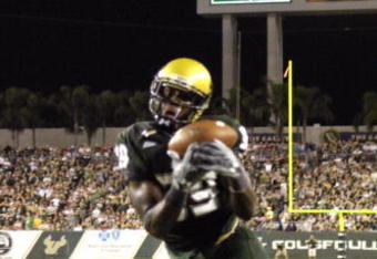 TAMPA, FL - SEPTEMBER 12: Wide receiver Taurus Johnson #89 of the University of South Florida Bulls grabs a pass in the end zone for a touchdown against the Kansas University Jayhawks at Raymond James Stadium on September 12, 2008 in Tampa, Florida.  (Photo by Al Messerschmidt/Getty Images)