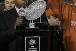PASADENA, CA - JANUARY 04:  Head coach Mack Brown of the Texas Longhorns celebrates with the National Championship trophy after defeating the USC Trojans 41-38 to win the BCS National Championship Rose Bowl Game on January 4, 2006 in Pasadena, California.  (Photo by Stephen Dunn/Getty Images)