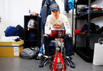 SUZUKA, JAPAN - OCTOBER 04:  Sebastian Vettel of Germany and Red Bull Racing celebrates with the winners trophy in his changing room after victory the Japanese Formula One Grand Prix at Suzuka Circuit on October 4, 2009 in Suzuka, Japan.  (Photo by Mark Thompson/Getty Images)