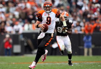 CLEVELAND - OCTOBER 04:  Carson Palmer #9 of the Cincinnati Bengals runs for a first down late in the overtime period against the Cleveland Browns during their game at Cleveland Browns Stadium on October 4, 2009 in Cleveland, Ohio. The Bengals defeated the Browns 23-20 in overtime.  (Photo by Jim McIsaac/Getty Images)