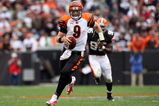 CLEVELAND - OCTOBER 04:  Carson Palmer #9 of the Cincinnati Bengals runs for a first down late in the overtime period against the Cleveland Browns during their game at Cleveland Browns Stadium on October 4, 2009 in Cleveland, Ohio. The Bengals defeated the Browns 23-20 in overtime.  (Photo by Jim McIsaac/Getty Images)