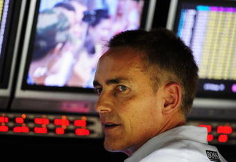 SINGAPORE - SEPTEMBER 26:  McLaren Mercedes Team Principal Martin Whitmarsh is seen on the pitwall during qualifying for the Singapore Formula One Grand Prix at the Marina Bay Street Circuit on September 26, 2009 in Singapore.  (Photo by Clive Mason/Getty Images)