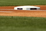 ANAHEIM, CA - SEPTEMBER 27:  A view of a base with an Angels logo beofre the game between the Los Angeles Angels of Anaheim and the Oakland Athletics on September 27, 2009 at Angel Stadium in Anaheim, California.   The Angels won 7-4. (Photo by Stephen Dunn/Getty Images)