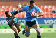 PRETORIA, SOUTH AFRICA - OCTOBER 03:   Pierre Spies gets past Jaco Bekker during the Absa Currie Cup match between Blue Bulls and GWK Griquas from Loftus Versfeld Stadium on October 03, 2009 in Pretoria, South Africa. (Photo by Lee Warren/Gallo Images/Getty Images)
