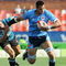 PRETORIA, SOUTH AFRICA - OCTOBER 03: Pierre Spies gets past Jaco Bekker during the Absa Currie Cup match between Blue Bulls and GWK Griquas from Loftus Versfeld Stadium on October 03, 2009 in Pretoria, South Africa. (Photo by Lee Warren/Gallo Images/Getty Images)
