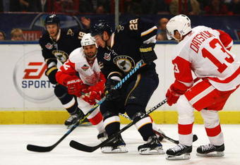 STOCKHOLM, SWEDEN - OCTOBER 03:  #13 Pavel Datsyuk of Detroit Red Wings battles for the puck with #22 Brad Boyes of St. Louis Blues during the 2009 Compuware NHL Premiere Stockholm match between St. Louis Blues and Detroit Red Wings at the Ericsson Globe on October 3, 2009 in Stockholm, Sweden.  (Photo by Paul Gilham/Getty Images)