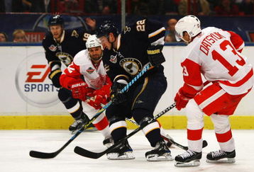 STOCKHOLM, SWEDEN - OCTOBER 03:  #13 Pavel Datsyuk of Detroit Red Wings battles for the puck with #22 Brad Boyes of St. Louis Blues during the 2009 Compuware NHL Premiere Stockholm match between St. Louis Blues and Detroit Red Wings at the Ericsson Globe on October 3, 2009 in Stockholm, Sweden.  (Photo by Paul Gilham/Getty Images)