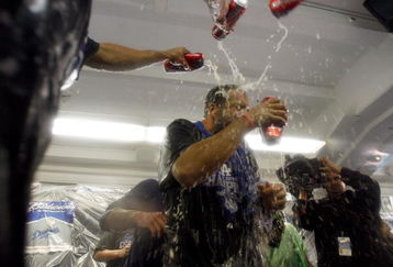 LOS ANGELES, CA - OCTOBER 03: Matt Kemp #27 of the Los Angeles Dodgers gets beer poured on his face as celebration after winning the National League West against the Colorado Rockies on October 3, 2009 in Los Angeles, California.  (Photo by Jacob de Golish/Getty Images)