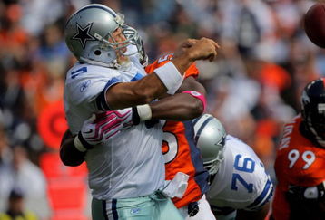 DENVER - OCTOBER 04:  Quarterback Tony Romo #9 of the Dallas Cowboys is hit by Robert Ayers #56 of the Denver Broncos during NFL action at Invesco Field at Mile High on October 4, 2009 in Denver, Colorado. The Broncos defeated the Cowboys 17-10.  (Photo by Doug Pensinger/Getty Images)