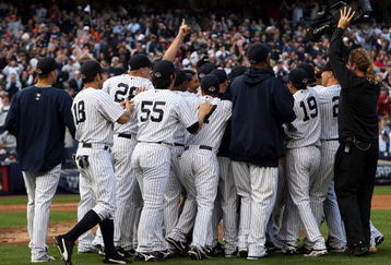 NEW YORK - SEPTEMBER 27:  The New York Yankees celebrate after defeating the Boston Red Sox on September 27, 2009 at Yankee Stadium in the Bronx borough of New York City. The Yankees won the game 4-2 to earn their 100th win of the season as well as clinching the American League Eastern Division.  (Photo by Jim McIsaac/Getty Images)
