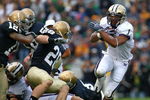 SOUTH BEND, IN - OCTOBER 03: Chris Polk #1 of the Washington Huskies finds some running room as Kyle McCarthy #28  and Robert Blanton #12 of the Notre Dame Fighting Irish pursue on October 3, 2009 at Notre Dame Stadium in South Bend, Indiana. (Photo by Jonathan Daniel/Getty Images)