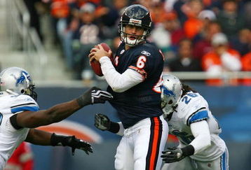 CHICAGO - OCTOBER 04: Jay Cutler #6 of the Chicago Bears is sacked by Cliff Avril #92 and Louis Delmas #26 of the Detroit Lions on October 4, 2009 at Soldier Field in Chicago, Illinois. The Bears defeated the Lions 48-24. (Photo by Jonathan Daniel/Getty Images)