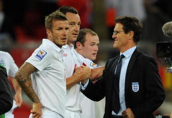 LONDON - SEPTEMBER 09:   England Manager Fabio Capello congratulates David Beckham and John Terry of England at the end of the FIFA 2010 World Cup Group 6 Qualifying match between England and Croatia at Wembley Stadium on September 9, 2009 in London, England. (Photo by Shaun Botterill/Getty Images)