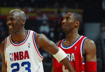 ATLANTA, GA - FEBRUARY 9:  Michael Jordan (Washington Wizards) #23 of the Eastern Conference All-Stars jokes with Kobe Bryant (Los Angeles Lakers) #8 of the Western Conference All-Stars during the 2003 NBA All-Star Game on February 9, 2003 at Philips Arena in Atlanta, Georgia.  NOTE TO USER:  User expressly acknowledges and agrees that, by downloading and or using this photograph, user is consenting to the terms and conditions of the Getty Images license agreement. (Photo by Jamie Squire/Getty Images)