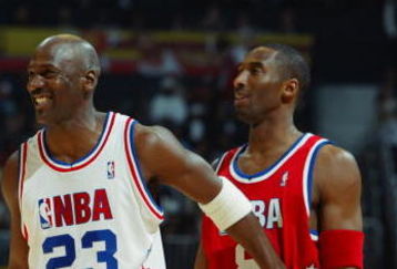 ATLANTA, GA - FEBRUARY 9:  Michael Jordan (Washington Wizards) #23 of the Eastern Conference All-Stars jokes with Kobe Bryant (Los Angeles Lakers) #8 of the Western Conference All-Stars during the 2003 NBA All-Star Game on February 9, 2003 at Philips Arena in Atlanta, Georgia.  NOTE TO USER:  User expressly acknowledges and agrees that, by downloading and or using this photograph, user is consenting to the terms and conditions of the Getty Images license agreement. (Photo by Jamie Squire/Getty Images)