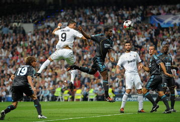 MADRID, SPAIN - SEPTEMBER 30:  Cristiano Ronaldo (2nd L) of Real Madrid duels for the ball with Taye Taiwo (3rd L) of Marseille during the Champions League group C match between Real Madrid and Marseille at the Estadio Santiago Bernabeu on September 30, 2009 in Madrid, Spain. Real Madrid won the match 3-0.  (Photo by Jasper Juinen/Getty Images)
