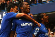 LONDON - OCTOBER 04: Florent Malouda of Chelsea (R) celebrates with team mates Didier Drogba (C) and Michael Ballack as he scores their second goal during the Barclays Premier League match between Chelsea and Liverpool at Stamford Bridge on October 4, 2009 in London, England. (Photo by Ian Walton/Getty Images)