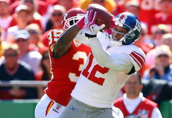 KANSAS CITY, MO - OCTOBER 04:  Brandon Carr #39 of the Kansas City Chiefs breaks up a pass intended for Steve Smith #12 of the New York Giants during the game on October 4, 2009 at Arrowhead Stadium in Kansas City, Missouri.  (Photo by Jamie Squire/Getty Images)