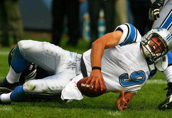 CHICAGO - OCTOBER 04: Matthew Stafford #9 of the Detroit Lions yells as he is sacked by Adewale Ogunleye #93 of the Chicago Bears on October 4, 2009 at Soldier Field in Chicago, Illinois. The Bears defeated the Lions 48-24. (Photo by Jonathan Daniel/Getty Images)