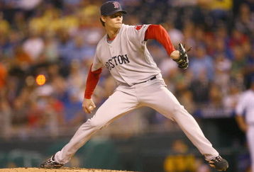 KANSAS CITY, MO - SEPTEMBER 24: Starting pitcher Clay Buchholz #61 of the Boston Red Sox pitches during the game against the Kansas City Royals on September 24, 2009 at Kauffman Stadium in Kansas City, Missouri. (Photo by Jamie Squire/Getty Images)