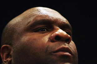 LONDON - FEBRUARY 10: Robert Malcolm Sapp also known as Bob The Beast Sapp eyes off a potential challenger during the Cage Rage Championship 20 Born to fight event at Wembley Arena on February 10, 2007 in London, England. Cage Fighting also known as MMA, Mixed Martial Arts is a mixed fighting style combat sport with a steadily growing international fan base. MMA is an evolving combat sport where competitors combine different disciplines that include jiu-jitsu, judo, karate, boxing, kickboxing, wrestling and others to their strategic and tactical advantage in a competetive arena.  (Photo by Daniel Berehulak/Getty Images)