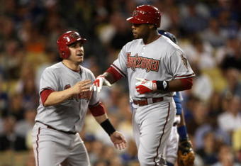 LOS ANGELES - SEPTEMBER 2:   Brandon Allen #25 (R) of the Arizona Diamondbacks is greeted by Miguel Montero #26 after both score on Allen's fifth inning home run against the Los Angeles Dodgers on September 2, 2009 at Dodger Stadium in Los Angeles, California.    (Photo by Stephen Dunn/Getty Images)