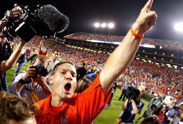 AUBURN, AL - SEPTEMBER 19:  Head coach Gene Chizik of the Auburn Tigers celebrates their 41-30 win over the West Virginia Mountaineers at Jordan-Hare Stadium on September 19, 2009 in Auburn, Alabama.  (Photo by Kevin C. Cox/Getty Images)