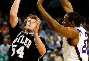 GREENSBORO, NC - MARCH 19:  Matt Howard #54 of the Butler Bulldogs shoots against Storm Warren #24 of the Louisiana State University Tigers during the first round of the NCAA Division I Men's Basketball Tournament at the Greensboro Coliseum on March 19, 2009 in Greensboro, North Carolina.  (Photo by Streeter Lecka/Getty Images)