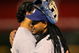 DENVER - AUGUST 25: Manny Ramirez #99 of the Los Angeles Dodgers hugs teammate Andre Ethier #16 after Ramirez stranded him on second base against the Colorado Rockies at Coors Field on August 25, 2009 in Denver, Colorado. The Rockies defeated the Dodgers 5-4 in 10 innings. (Photo by Doug Pensinger/Getty Images)
