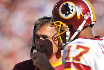 LANDOVER, MD - OCTOBER 4:  Head coach Jim Zorn speaks with Jason Campbell #17 of the Washington Redskins during a time out against the Tampa Bay Buccaneers at FedExField on October 4, 2009 in Landover, Maryland. The Redskins defeated the Buccaneers 16-13. (Photo by Larry French/Getty Images)