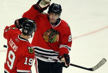 CHICAGO - MAY 11:  (L-R) Jonathan Toews #19 and Patrick Kane #88 of the Chicago Blackhawks celebrate after Kane scored his third goal of the game to record a hat trick against the Vancouver Canucks during the third period Game Six of the Western Conference Semifinal Round of the 2009 Stanley Cup Playoffs on May 11, 2009 at the United Center in Chicago, Illinois.  (Photo by Jonathan Daniel/Getty Images)