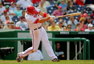WASHINGTON - AUGUST 6:  Ryan Zimmerman #11 of the Washington Nationals triples to right against the Florida Marlins during their MLB game on August 6, 2009 at Nationals Park in Washington, DC.  (Photo by Doug Pensinger/Getty Images)