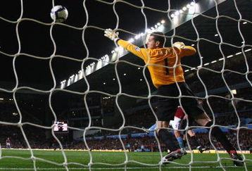 BIRMINGHAM, ENGLAND - OCTOBER 05:  Shay Given of Manchester City is unable to stop Richard Dunne of Aston Villa scoring the opening goal during the Barclays Premier League match between Aston Villa and Manchester City at Villa Park on October 5, 2009 in Birmingham, England.  (Photo by Clive Rose/Getty Images)