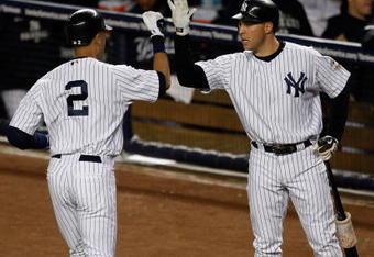 NEW YORK - SEPTEMBER 30:  Derek Jeter #2 is congratulated by Mark Teixeira #25 of the New York Yankees after he hit a solo home run in the first inning against the Kansas City Royals during the game on September 30, 2009 at Yankee Stadium in the Bronx borough of New York City.  (Photo by Jared Wickerham/Getty Images)
