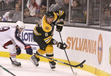 BOSTON, MA - SEPTEMBER 26: Dennis Wideman #6 of the Boston Bruins is pressed by Matt Calvert #69 of the Columbus Blue Jackets at the TD Banknorth Garden during preseason play on September 26, 2009 in Boston, Massachusetts.(Photo by Jim Rogash/Getty Images)